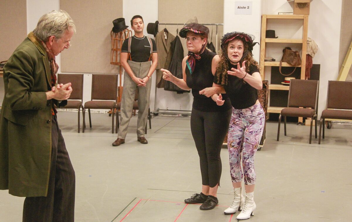 Robert Joy, Dan Rosales, Jacque Wilke and Cathryn Wake (from left) rehearse a scene from "Ebenezer Scrooge's BIG San Diego Christmas Show" at the Old Globe Theatre.