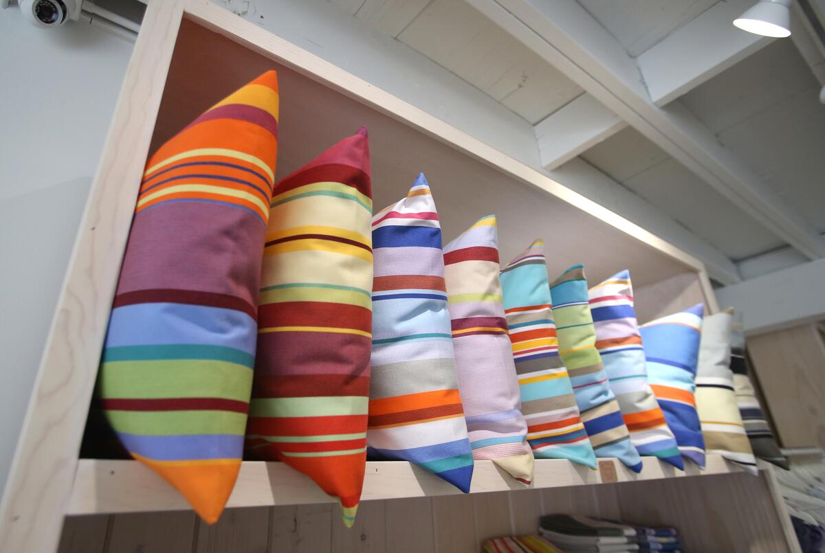 Colorful pillows are on display at the new store Ligne Blanche in the HIP District in Laguna Beach.