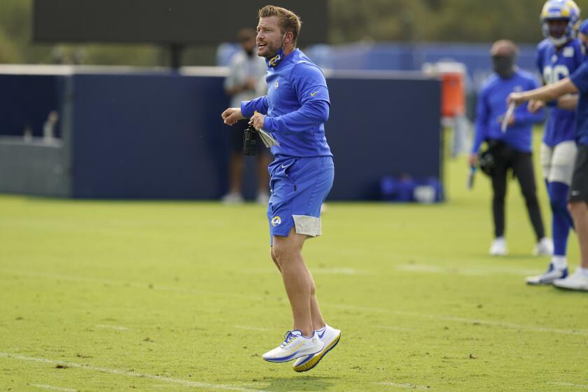 Los Angeles Rams head coach Sean McVay jumps in the middle of the field during an NFL football camp practice Tuesday, Aug. 18, 2020, in Thousand Oaks, Calif. (AP Photo/Marcio Jose Sanchez)