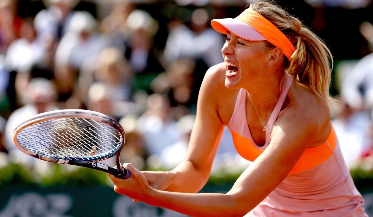 Maria Sharapova tracks down a return shot during a three-set victory over Eugenie Bouchard in the French Open semifinals on Friday.