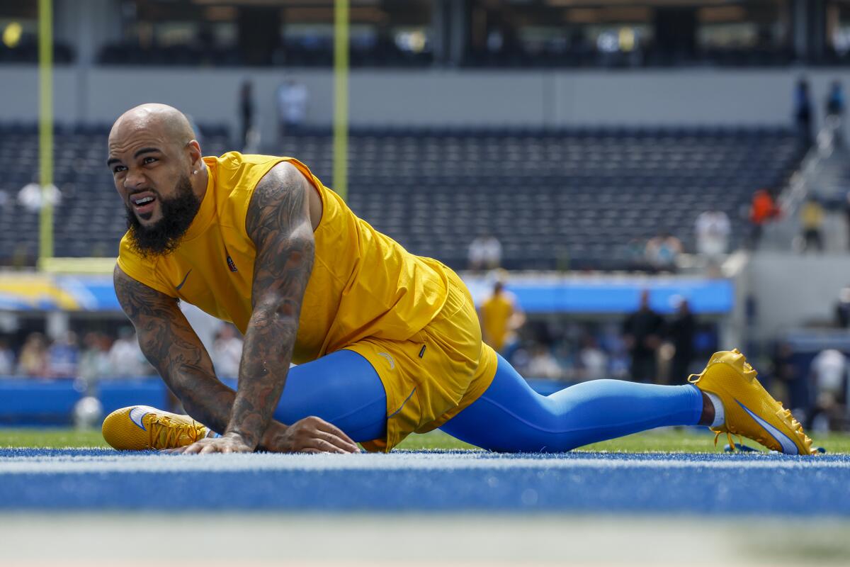 Chargers receiver Keenan Allen stretches before a game against the Miami Dolphins at SoFi Stadium in Saturday.