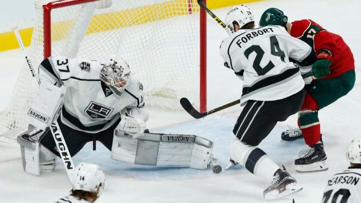 Kings goaltender Jeff Zatkoff stops a shot during a game against the Wild on Oct. 18.