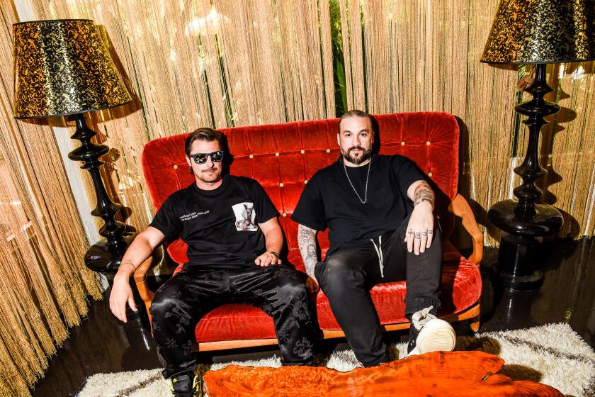 PALM SPRING, CA - APRIL 12: Swedish House Mafia members Axwell and Steve Angello pose for portraits in the Parker Palm Springs hotel in Palm Springs, CA before they headline the Coachella Festival 2022. (CREDIT: David Vassalli / For The Times).