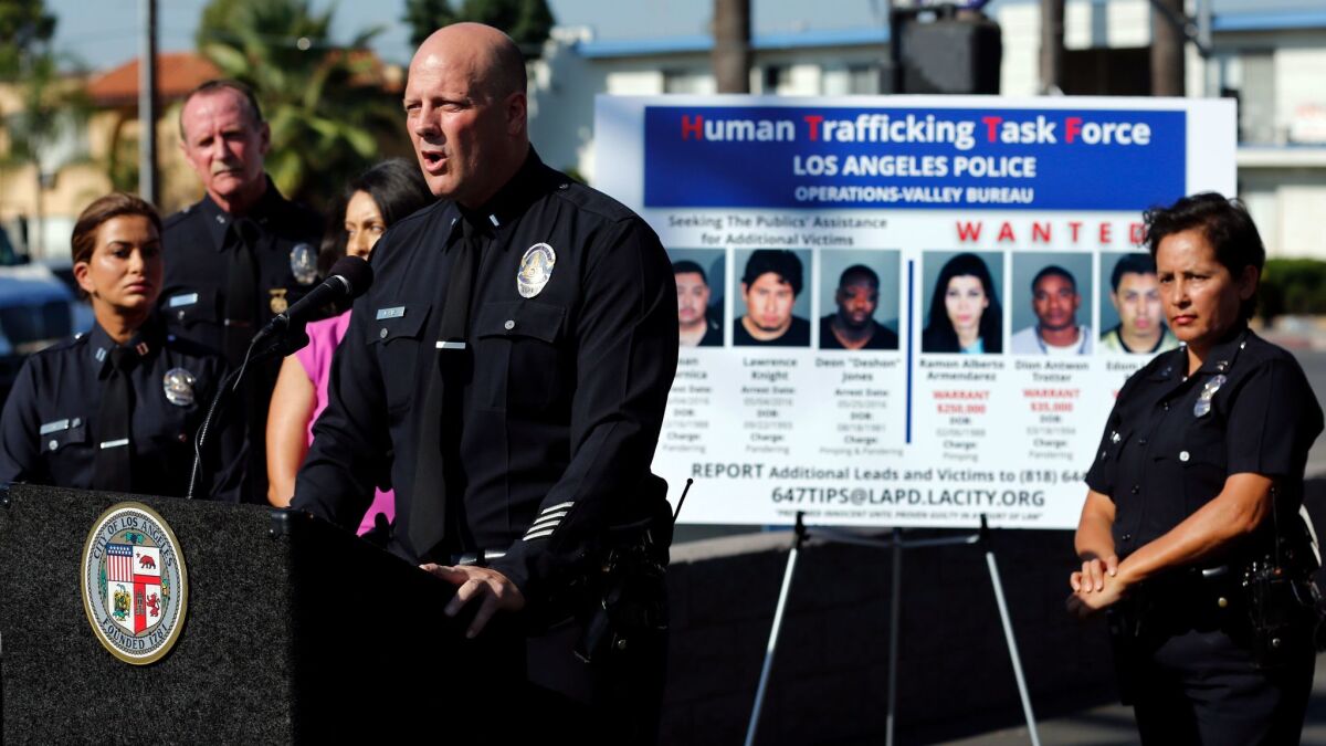 Los Angeles Police Lt. Marc Evans addresses the media after arrests to break up a sex trafficking ring in Van Nuys in 2016. The latest sweep, involving the Sheriff's Department, targeted traffickers in Compton.
