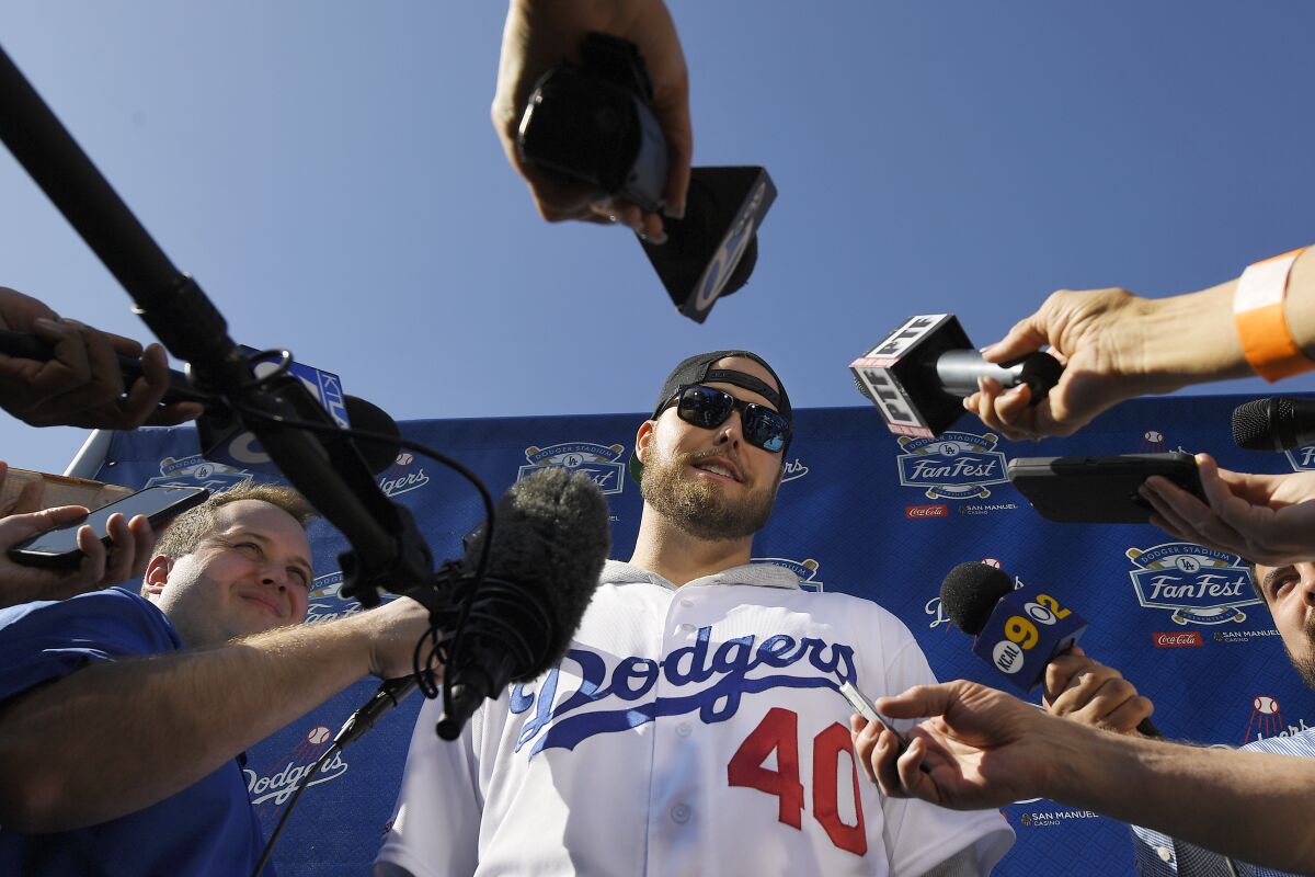 Pitcher Jimmy Nelson is interviewed by reporters during the Dodgers' FanFest on Jan. 25, 2020.