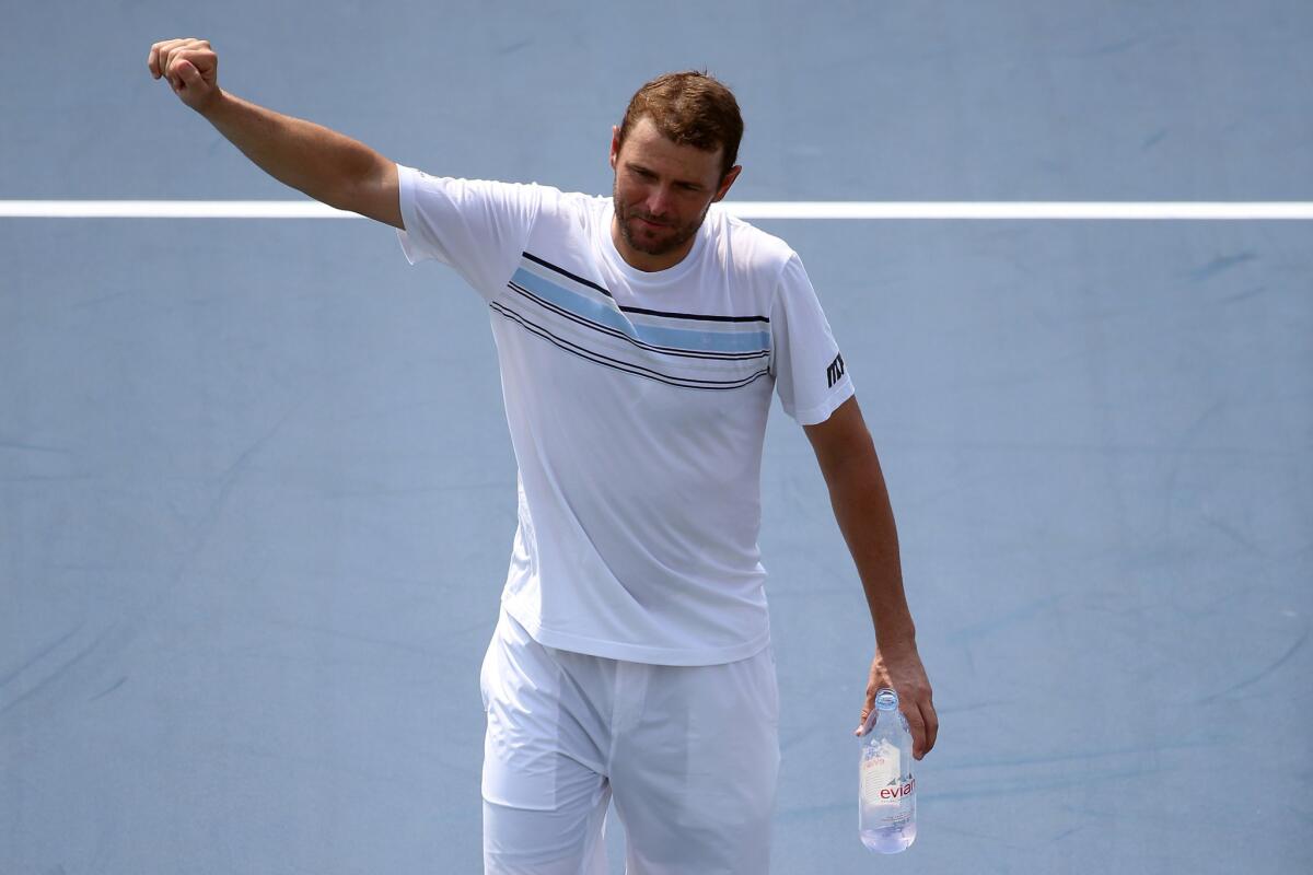 Mardy Fish walks off of the court after losing his U.S. Open second round match against Feliciano Lopez.