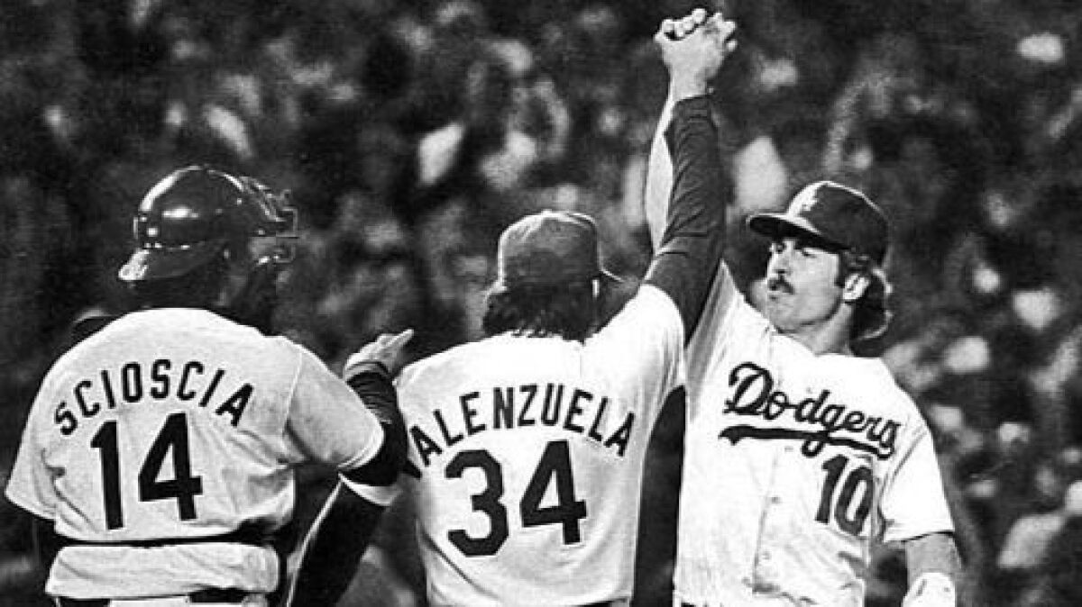 Oct. 23, 1981: Dodgers pitcher Fernando Valenzuela is congratulated by teammates Mike Scioscia and Ron Cey after pitching a complete game.
