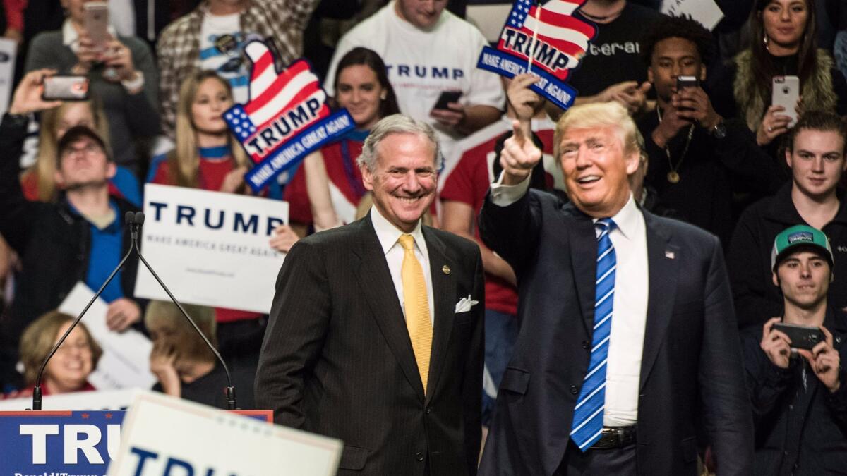 Henry McMaster with Donald Trump at a 2016 campaign rally in Florence, S.C. McMaster, now South Carolina's governor, signed an executive order aimed at restricting abortions.