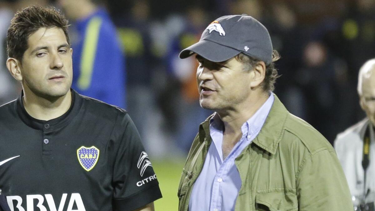 Boca Juniors goalkeeper Agustin Orion, left, stands next to Alejandro Burzaco, president of sports marketing company Torneos y Competencias before a match in Buenos Aires on May 14, 2015.