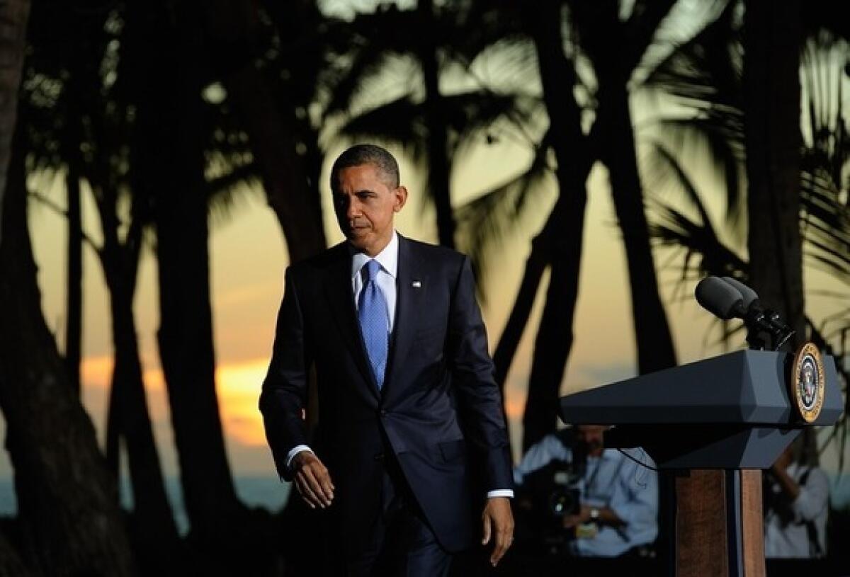 President Obama leaves the podium in Honolulu after the Asia-Pacific Economic Cooperation Summit on Nov. 13.