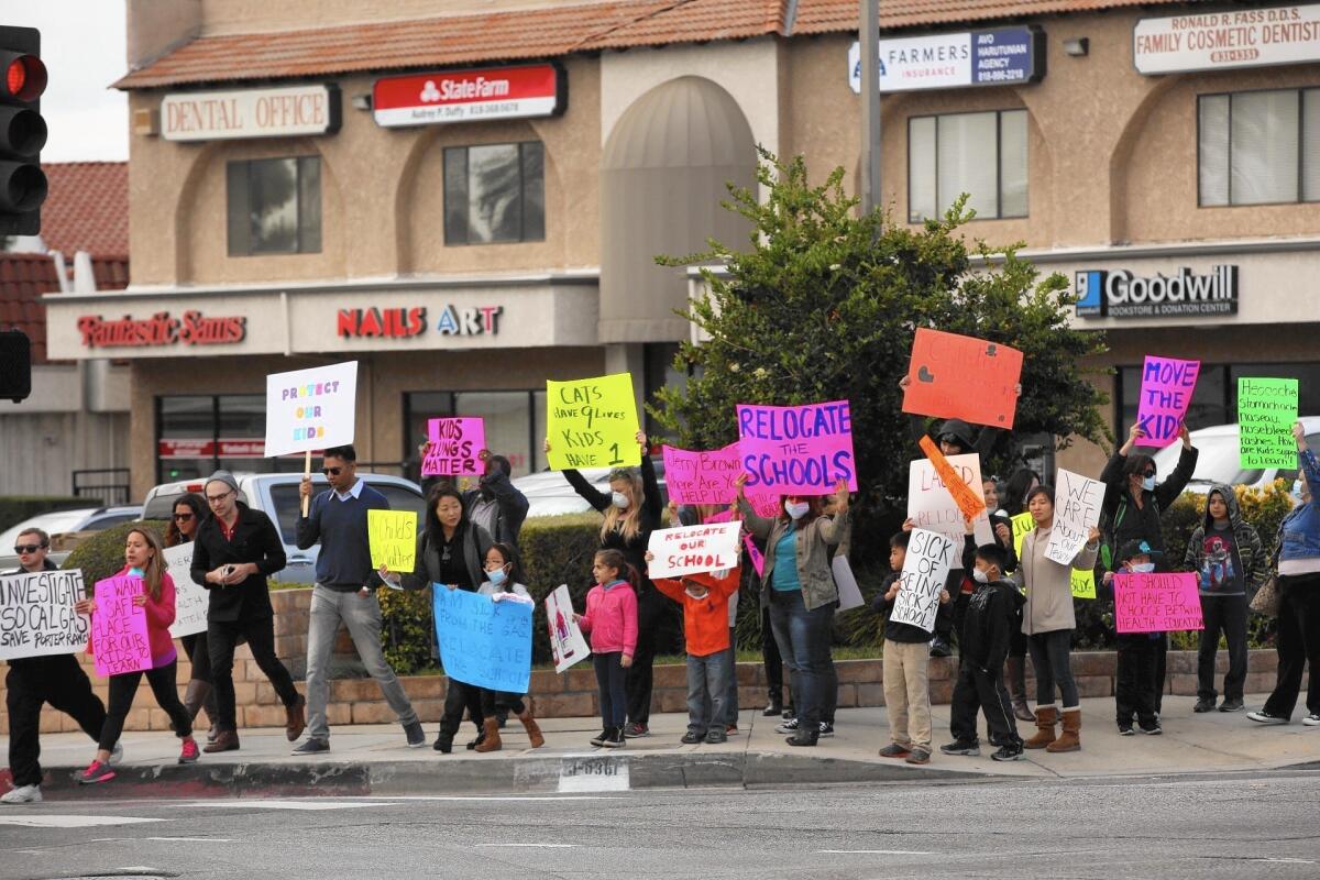 Students and parents protest in Porter Ranch on Dec. 11, calling for Los Angeles Unified officials to relocate students from two schools because of health concerns related to a leaking gas well.