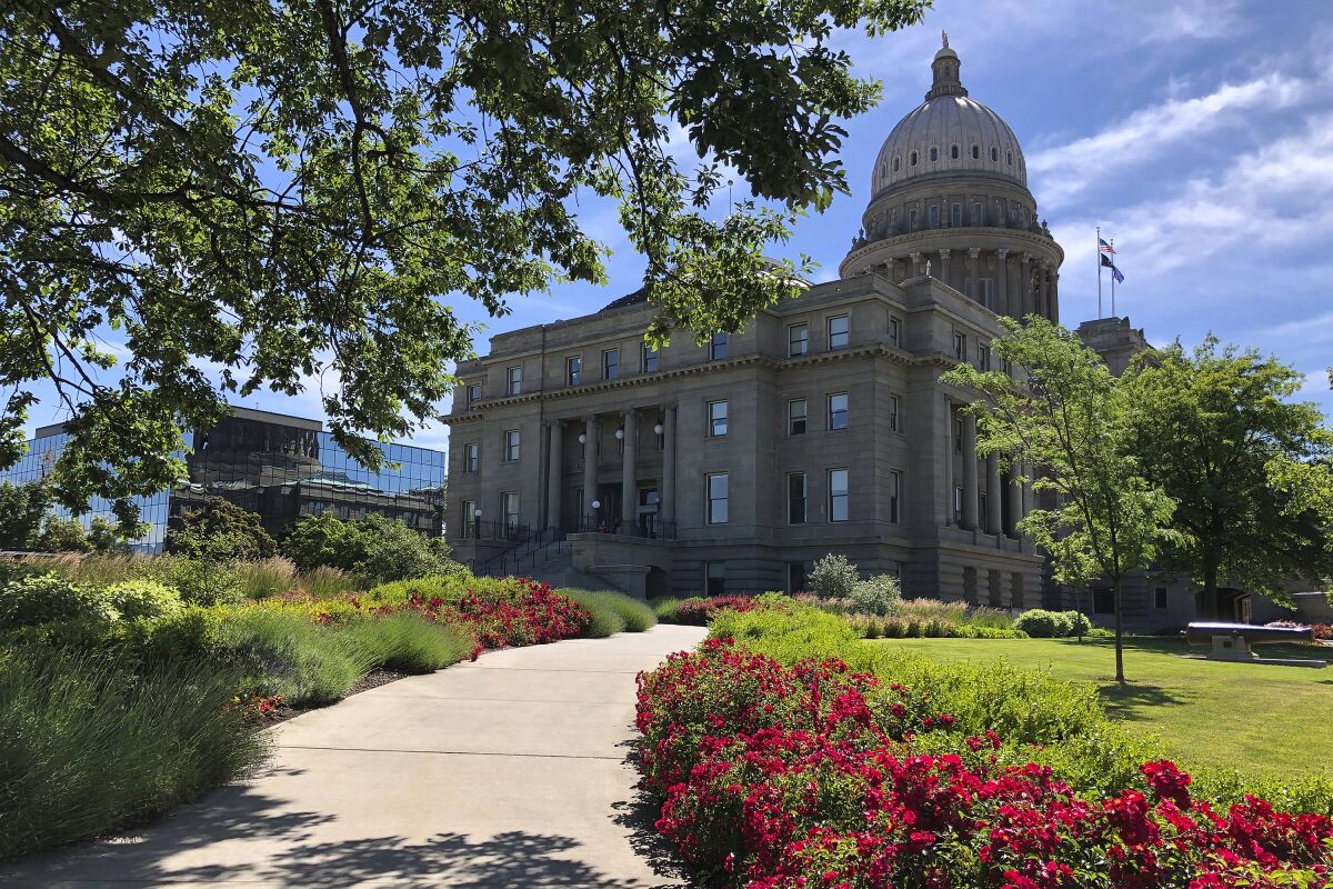 FILE - The Idaho State Capitol in Boise, Idaho, is seen on June 13, 2019. A federal lawsuit challenging Idaho's ban on transgender athletes in women's sports will likely move forward after both sides agreed that the woman who sued is again enrolled at Boise State University and competing in school athletics. (AP Photo/Keith Ridler, File)