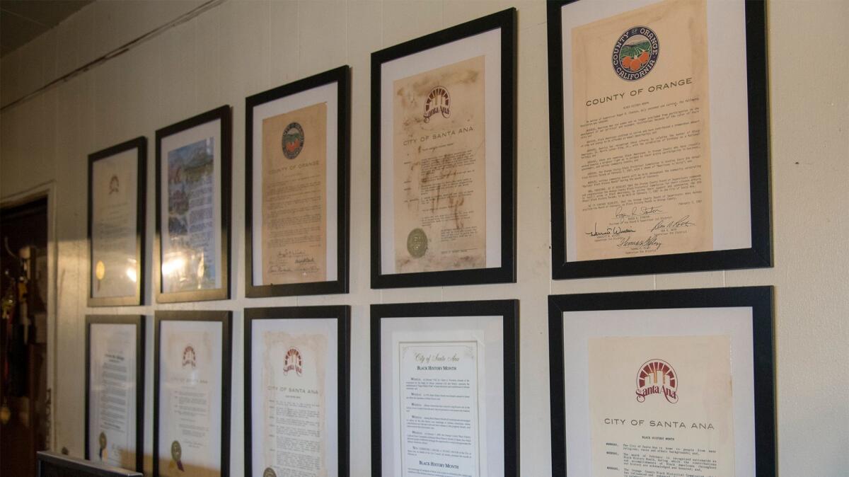 Accolades hang on the wall in the home of Helen Shipp, the founder of the Black History Parade in Orange County.