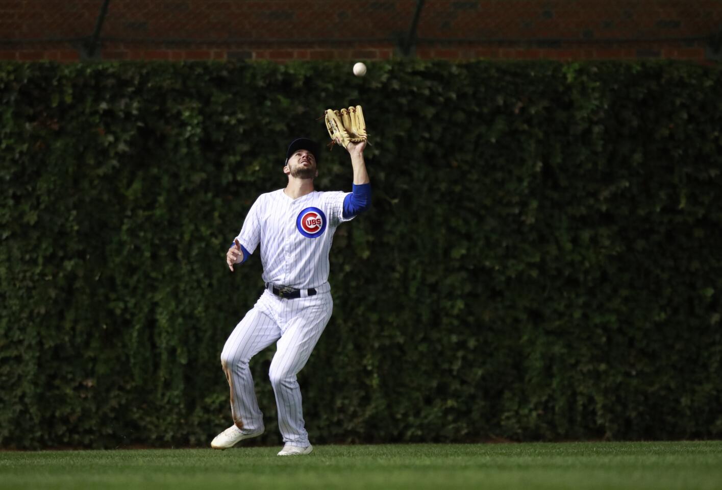 Cubs left fielder Kris Bryant catches a fly to left field against the Rockies during the National League wild-card game Oct. 2, 2018, at Wrigley Field.