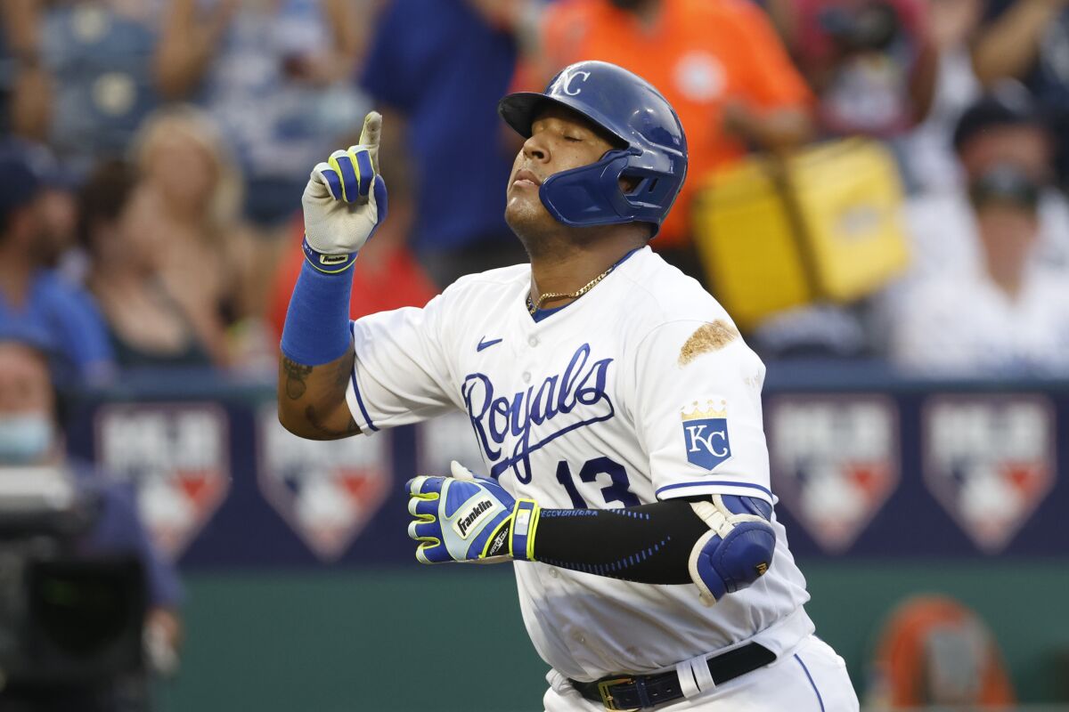 Kansas City Royals' Salvador Perez reacts after hitting a home run during the first inning of the team's baseball game against the New York Yankees at Kauffman Stadium in Kansas City, Mo., Tuesday, Aug. 10, 2021. (AP Photo/Colin E. Braley)