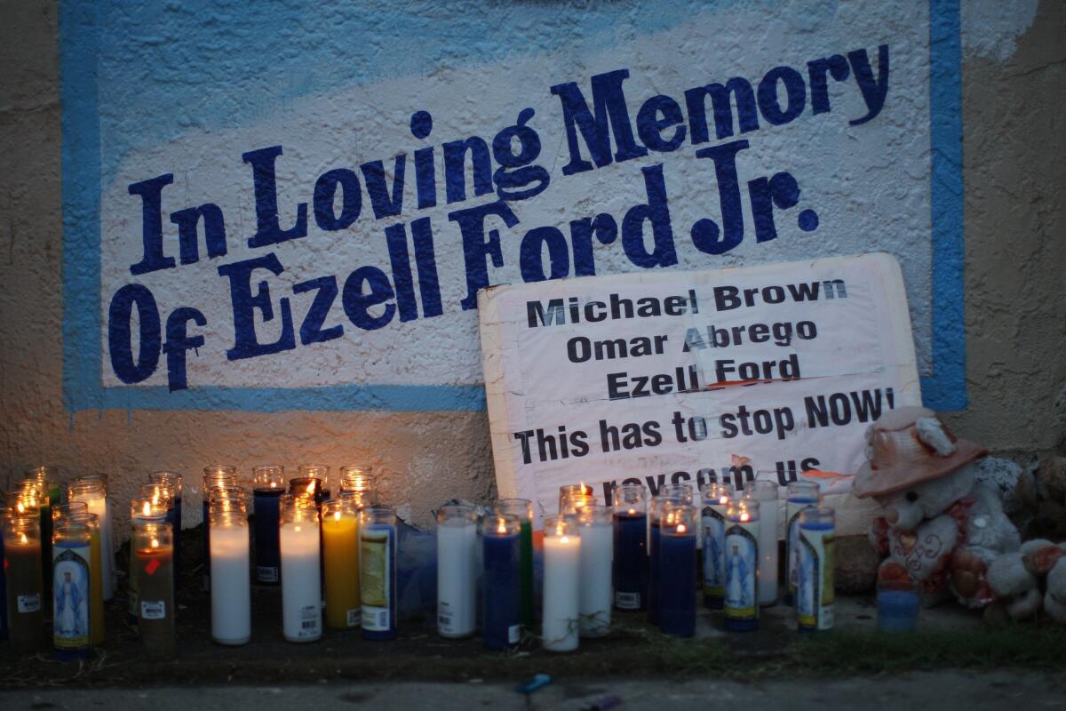 Candles burn at a memorial for Ezell Ford on Dec. 5 in Los Angeles.