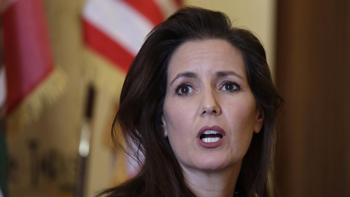 Mayor Libby Schaaf answers questions during a news conference at City Hall in Oakland, Calif.