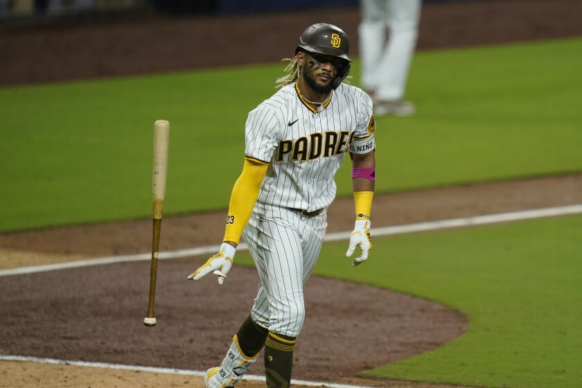 San Diego Padres' Fernando Tatis Jr. reacts after hitting a three-run home run during the sixth inning of Game 2 of a National League wild-card baseball series against the St. Louis Cardinals, Thursday, Oct. 1, 2020, in San Diego. (AP Photo/Gregory Bull)