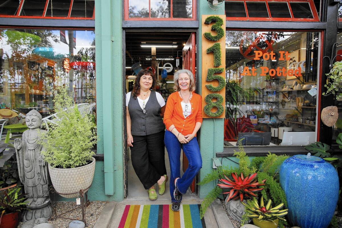 Potted owners Annette Gutierrez and Mary Gray in front of their store