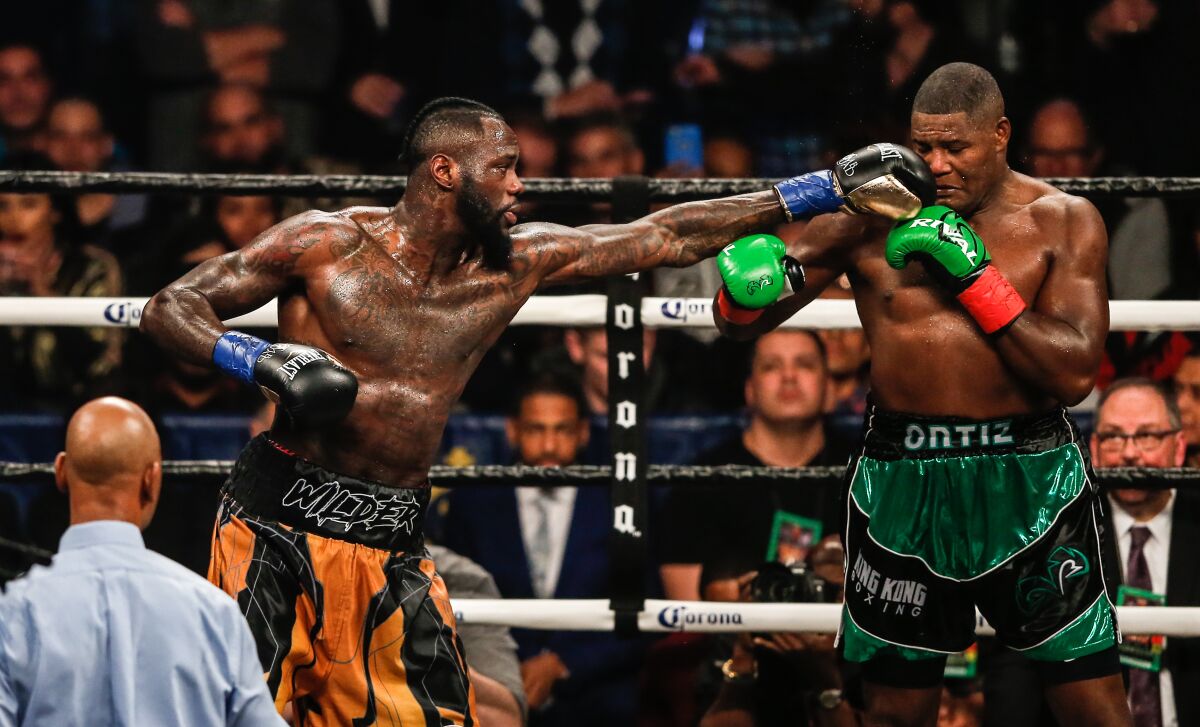 Deontay Wilder delivers a punch against Luis Ortiz in New York on March 3, 2018.