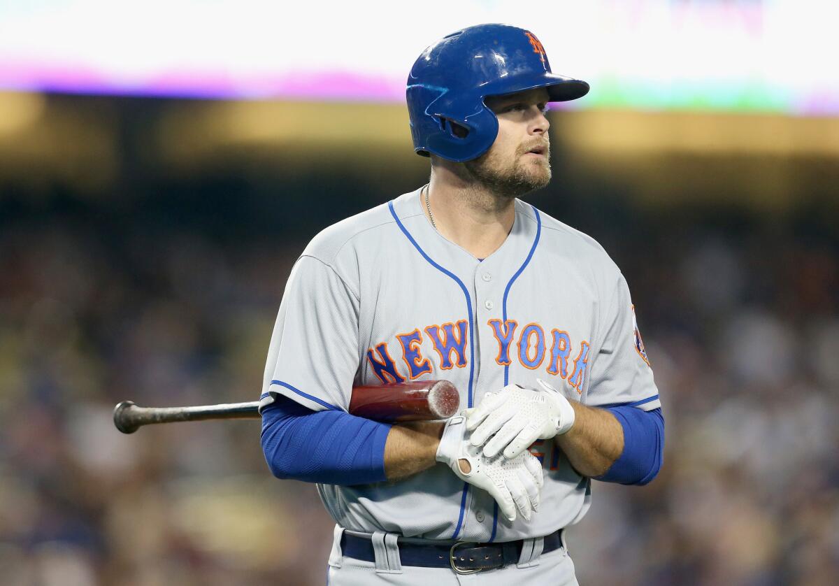 Mets hitter Lucas Duda (21) walks back to the dugout after an at-bat against Dodgers pitcher Clayton Kershaw.