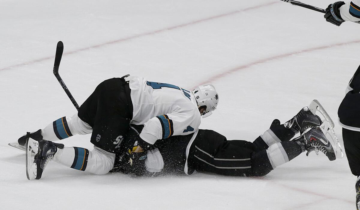 Kings defenseman Drew Doughty is pushed to the ice by Sharks defenseman Brenden Dillon late in the third period of Game 2.