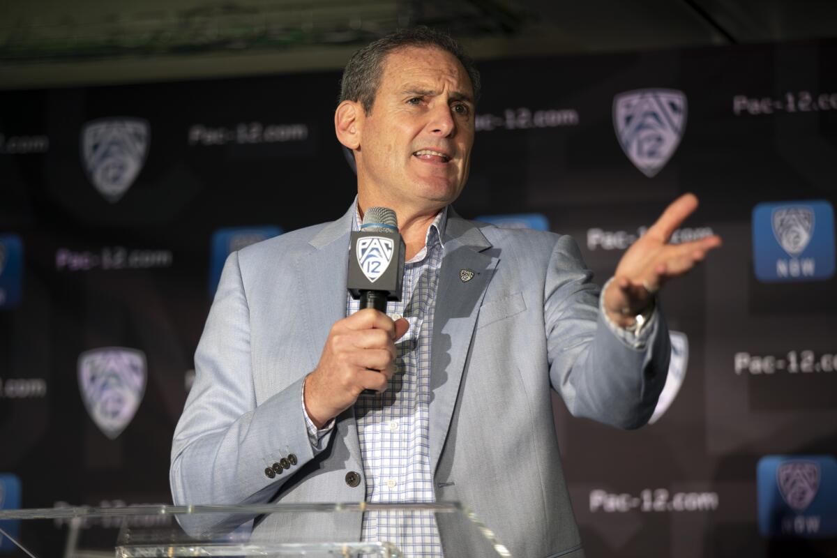 Commissioner Larry Scott speaks during the 2019 Pac-12 NCAA college basketball media day in San Francisco.