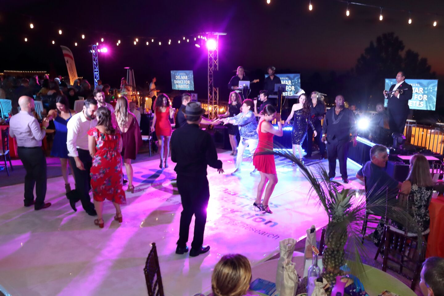 Guests take to the dance floor with entertainers from Encore Event Entertainment