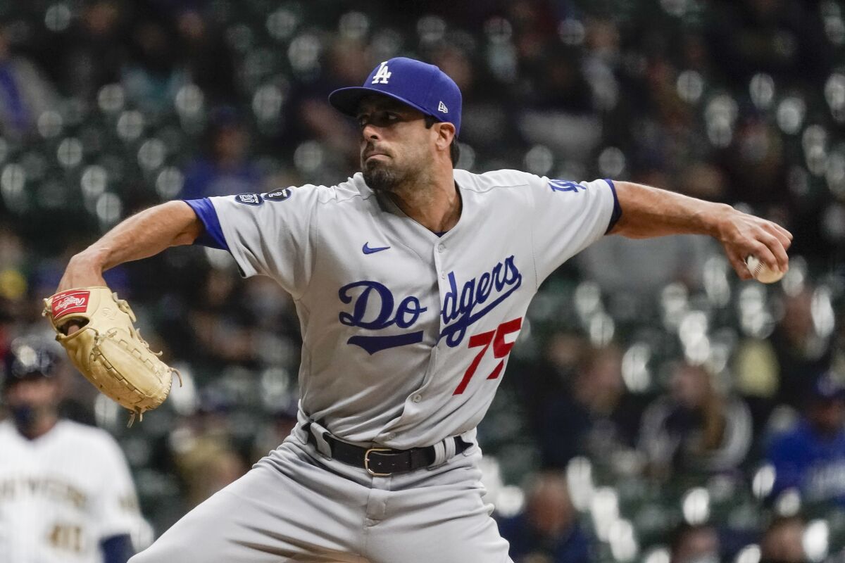 Los Angeles Dodgers Scott Alexander throws during the fourth inning of a baseball game.