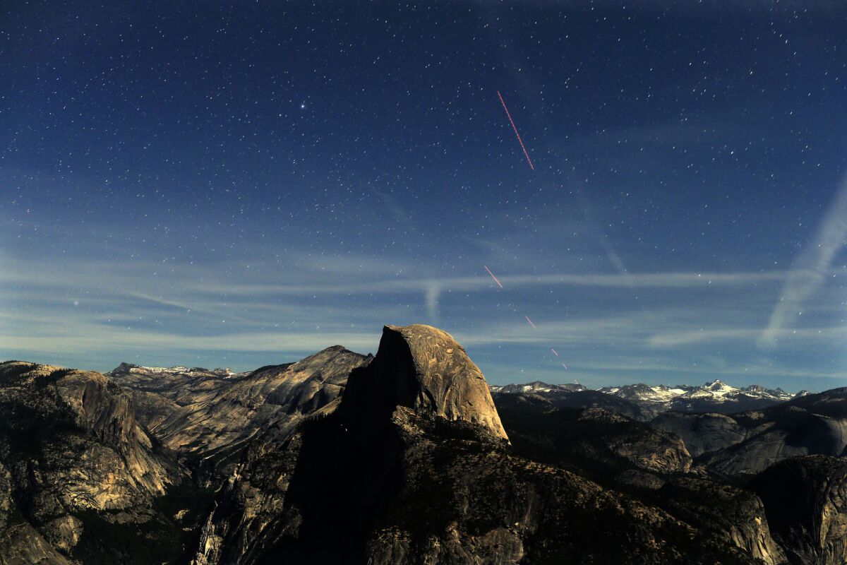Lighted by a very bright half moon, night becomes day during this 30-second time exposure of the skies over Half Dome, as seen from Glacier Point at 9:35 p.m.