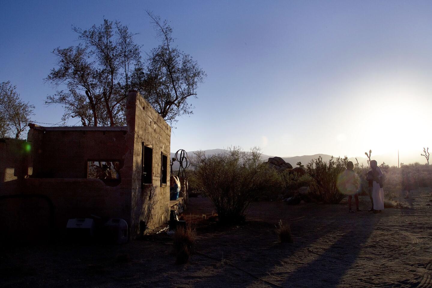 Dusk sets on ruins of a stone house transformed into an enchanting party spot in the Pipes Canyon area of Pioneertown, near Joshua Tree National Park. Owners Paul Goff and Tony Angelotti call it the Ruin, their place for potlucks under the stars.