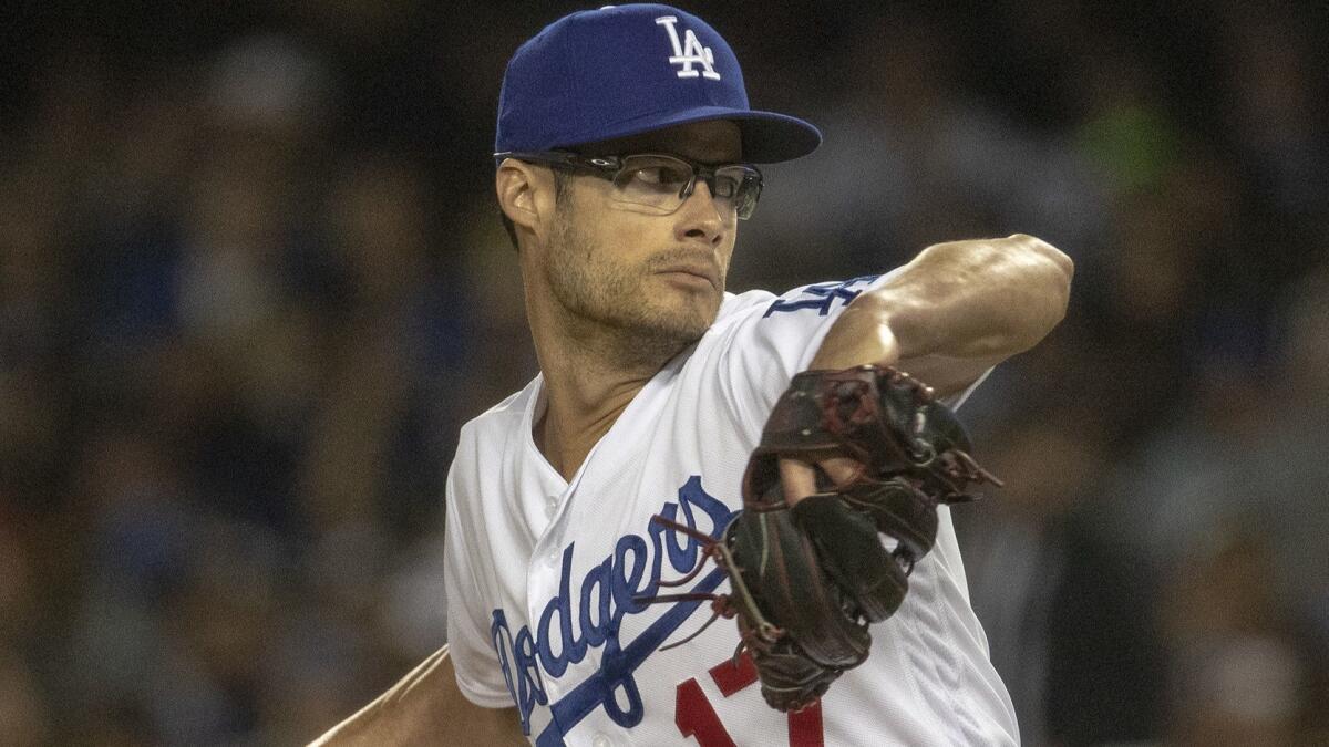 Dodgers pitcher Joe Kelly winds up on the mound in relief during game against the Arizona Diamondbacks at Dodger Stadium on March 29.