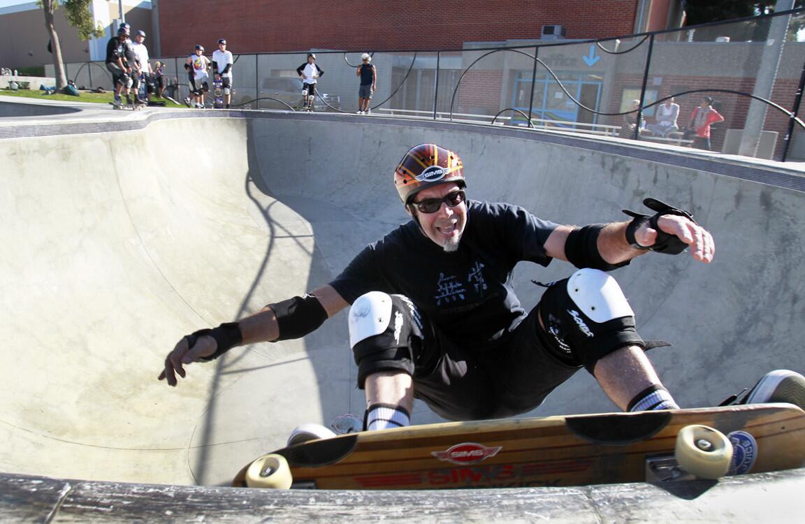 Scott Hostert, 51, a tax consultant from Brea, does a front-side grind in the bowl at the Cove in Santa Monica. Hostert says he has heard it all: You're too old. You're nuts. You don't want to live the rest of your life being fed through a tube, do you? Hostert scoffs, then smiles. Too old to ride a skateboard? Just watch.