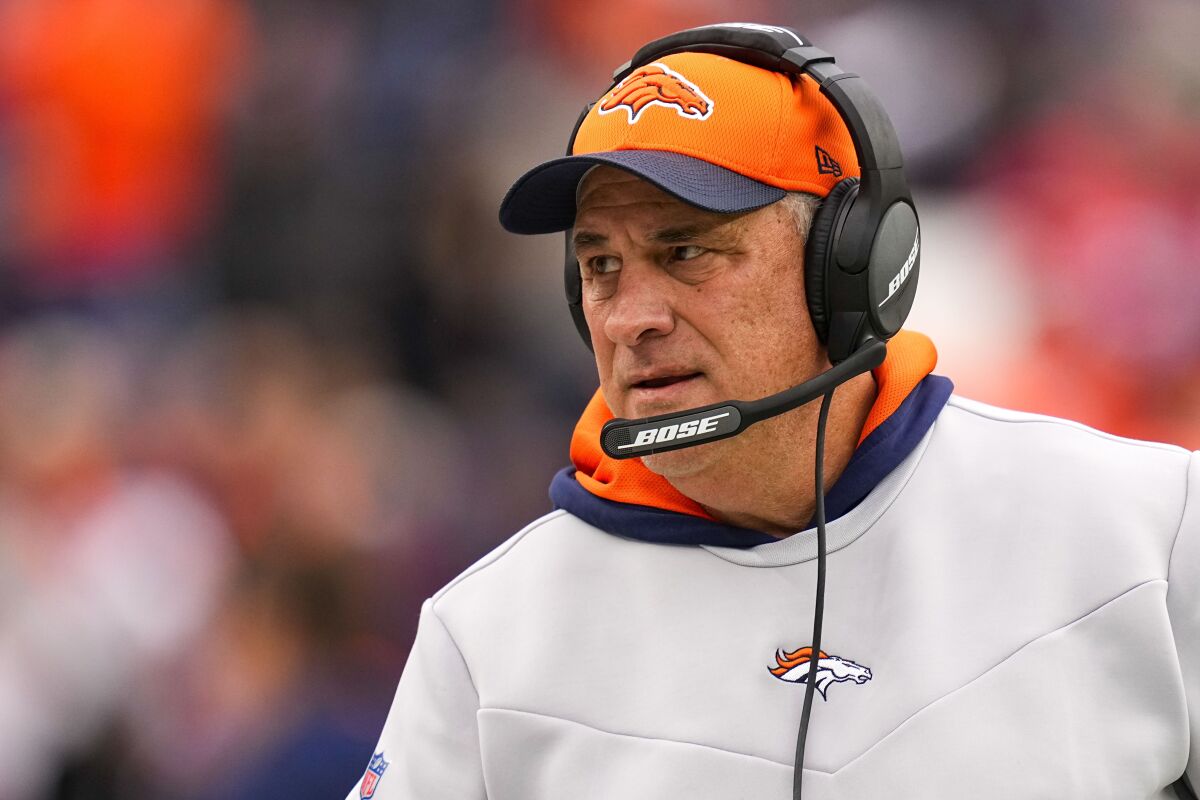 FILE - Denver Broncos head coach Vic Fangio looks on during an NFL football game against the Kansas City Chiefs, Jan. 8, 2022, in Denver. The Miami Dolphins have reached a deal with former Broncos coach Fangio to become their defensive coordinator, a person familiar with the hire told The Associated Press on Sunday, Jan. 29, 2023. (AP Photo/Jack Dempsey, File)