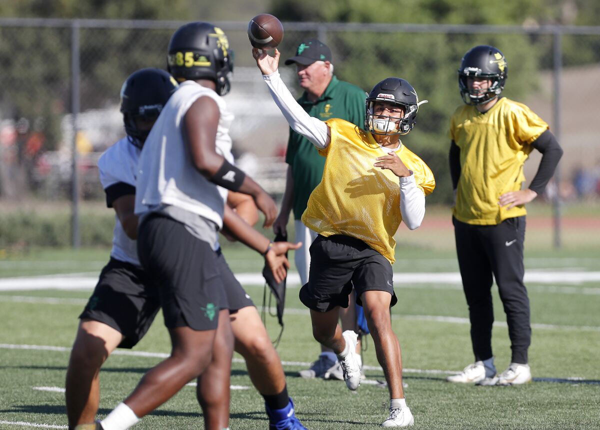 Golden West College quarterback Nathaniel Espinoza, shown during practice on Sept. 6, had four total touchdowns in Saturday's nonconference loss to San Diego Mesa.