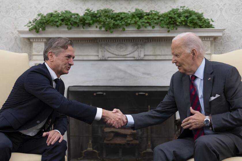 President Joe Biden shakes hands with Slovenia's Prime Minister Robert Golob, left, as they meet in the Oval Office of the White House in Washington, Tuesday, Oct. 22, 2024. (AP Photo/Ben Curtis)