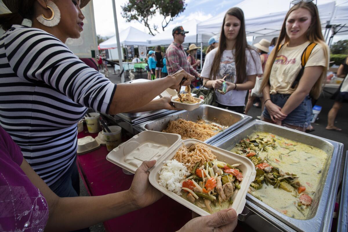 Green curry chicken and vegetables, with chicken pad thai noodles and white rice, from Pan's Thai Food stand at the Upcountry Farmers Market in Makawao sells for $10.