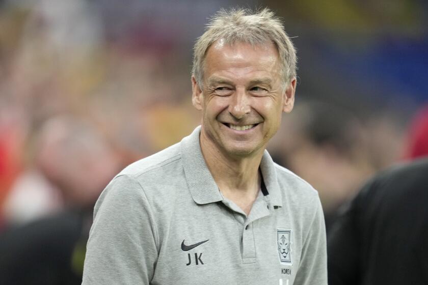 South Korea's head coach Jurgen Klinsmann smiles during the International friendly soccer match between Wales and South Korea at the Cardiff City Stadium in Cardiff, Wales, Thursday, Sept. 7, 2023 . (AP Photo/Kin Cheung)