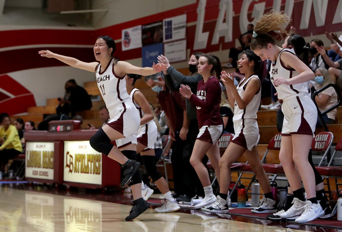 Laguna Beach junior Sabrina Yang, left, reacts after the Breakers beat Los Angeles Yeshiva 45-33 on Friday.