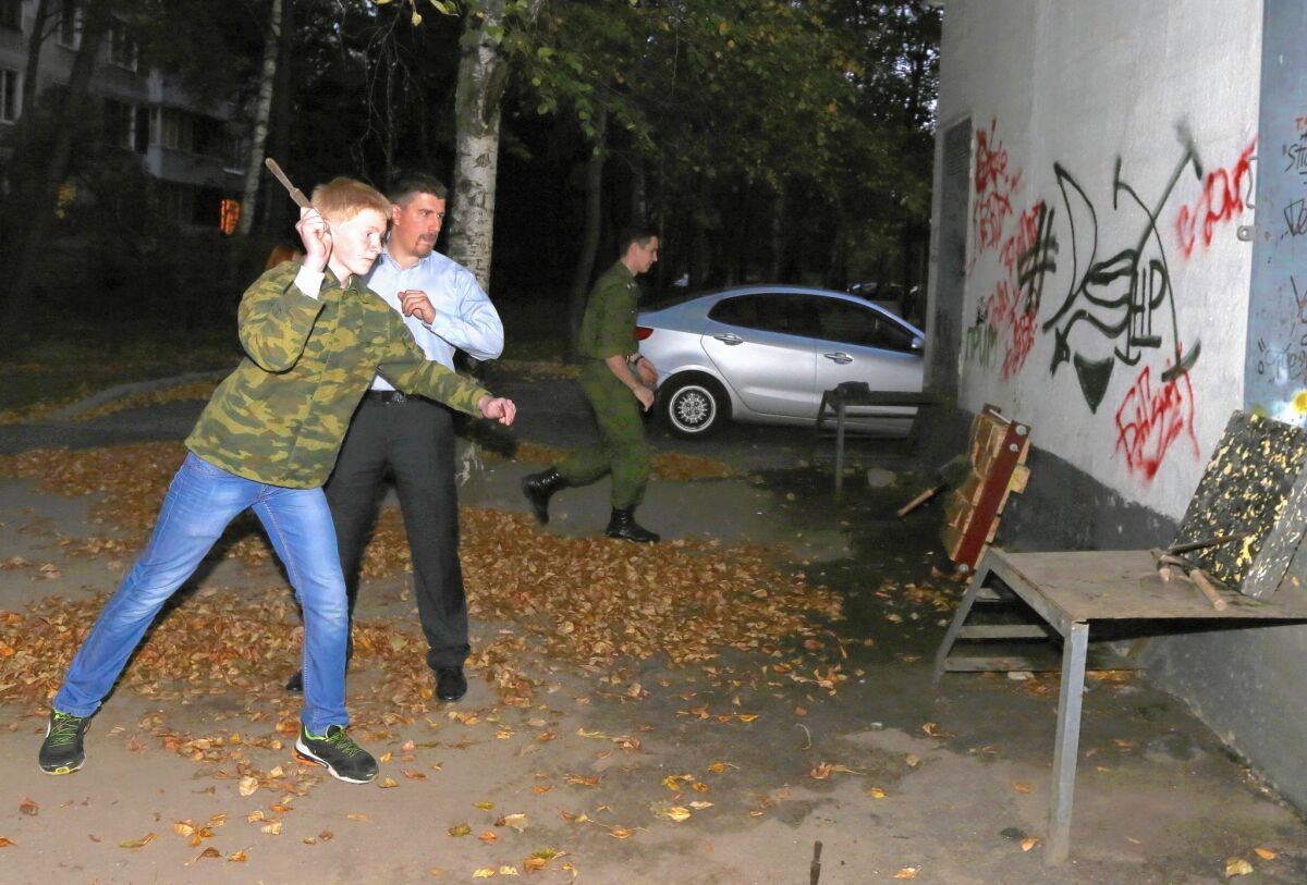 Stepan Zotov offers knife- and spade-throwing instruction to members of Our Army, a paramilitary youth group, in north Moscow.