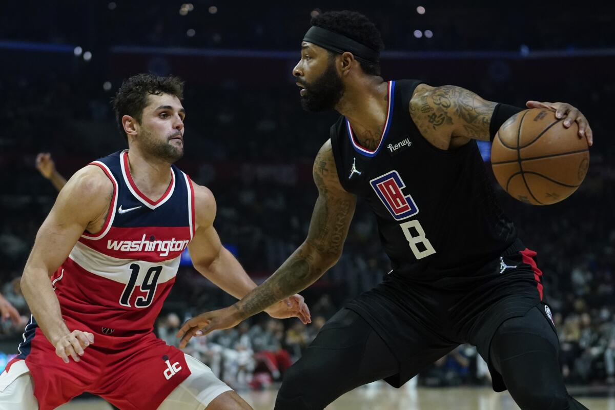 Washington Wizards guard Raul Neto defends against Clippers forward Marcus Morris Sr. 