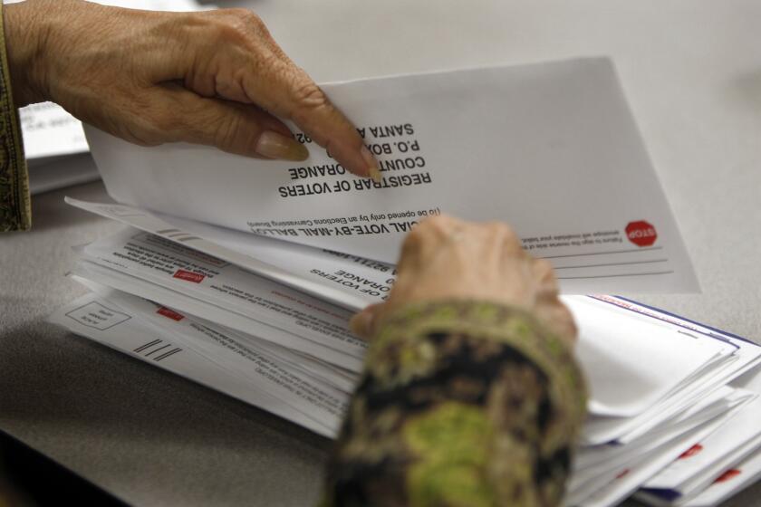 Mail-in ballots are counted in Santa Ana. A state Senate election next week shows the changed landscape of Orange County.