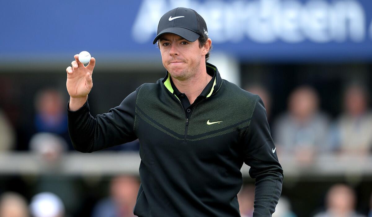 Rory McIlroy acknowledges the applause from the gallery at the 18th green during the first round of the Scottish Open on Thursday.