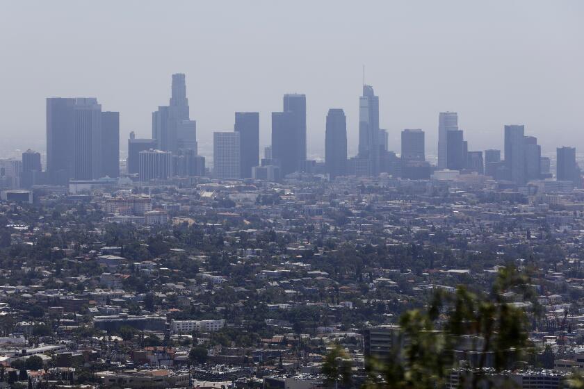 LOS ANGELES-CA-JULY 1, 2019: The downtown Los Angeles skyline is seen from Griffith Observatory on Monday, July 1, 2019. Smog is getting worse in Southern California, and the stakes are high for health and the economy. Officials say it will take $14 billion to fix the problem. (Christina House / Los Angeles Times)
