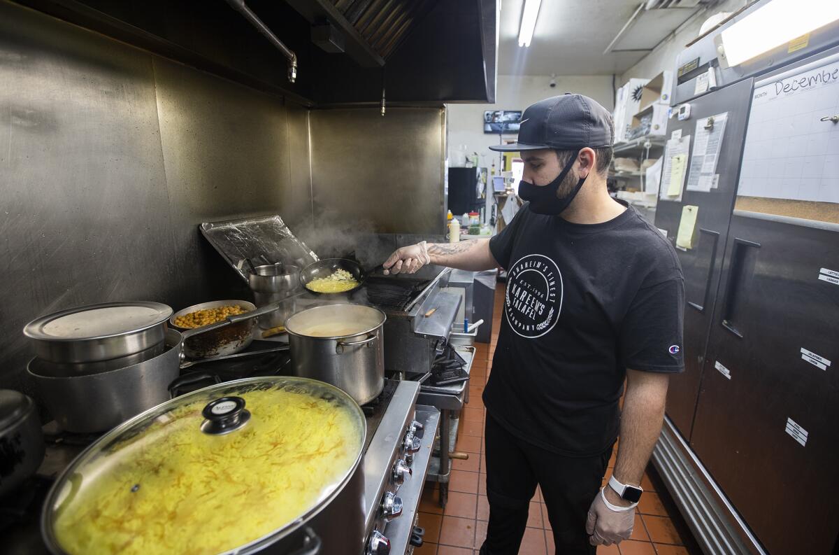 Kareem Hawari, owner of Kareem's Falafel in Anaheim, prepares lunch.