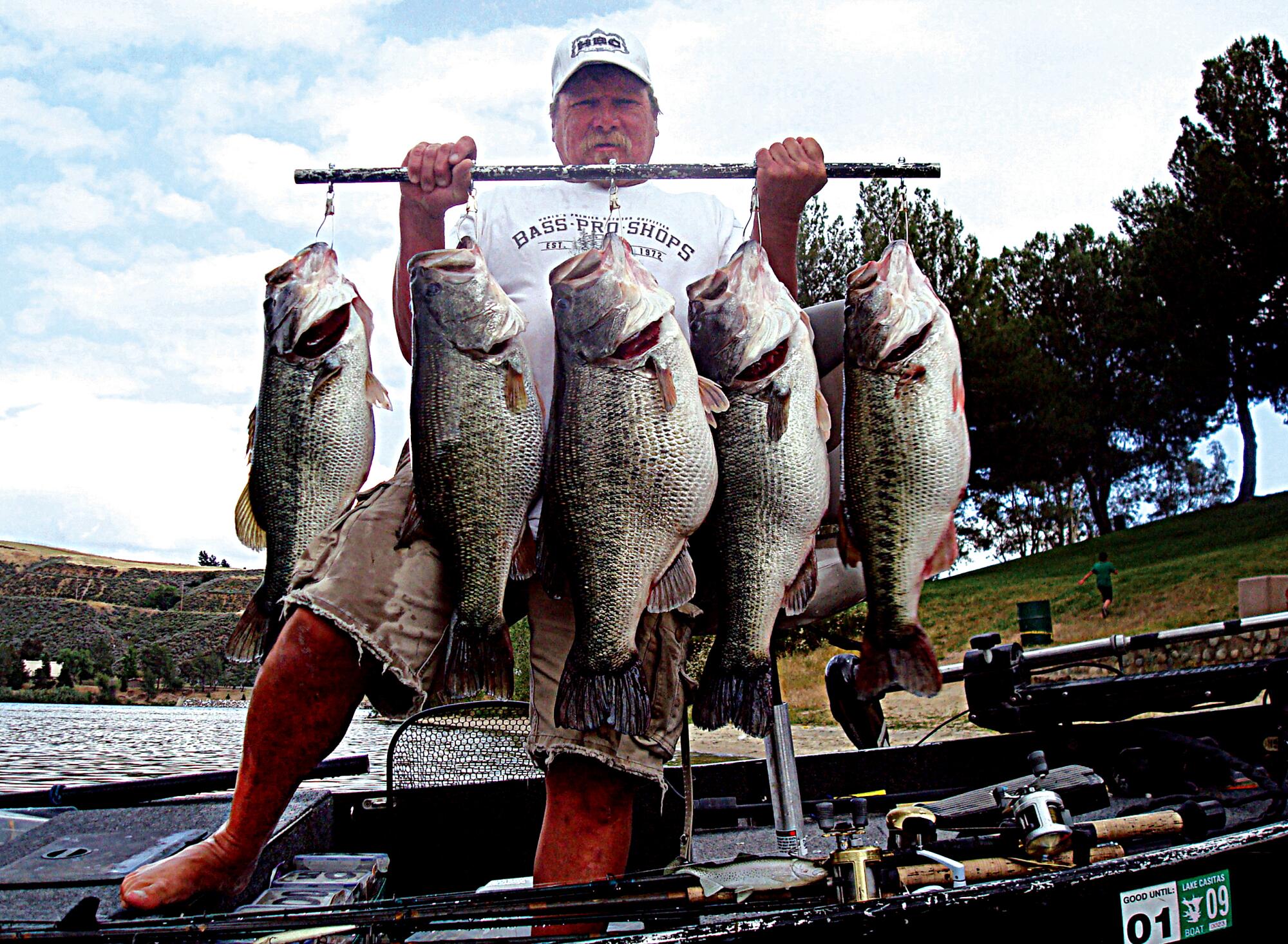 Trophy bass fisherman Butch Brown with five largemouth bass all weighing over 12 pounds. 