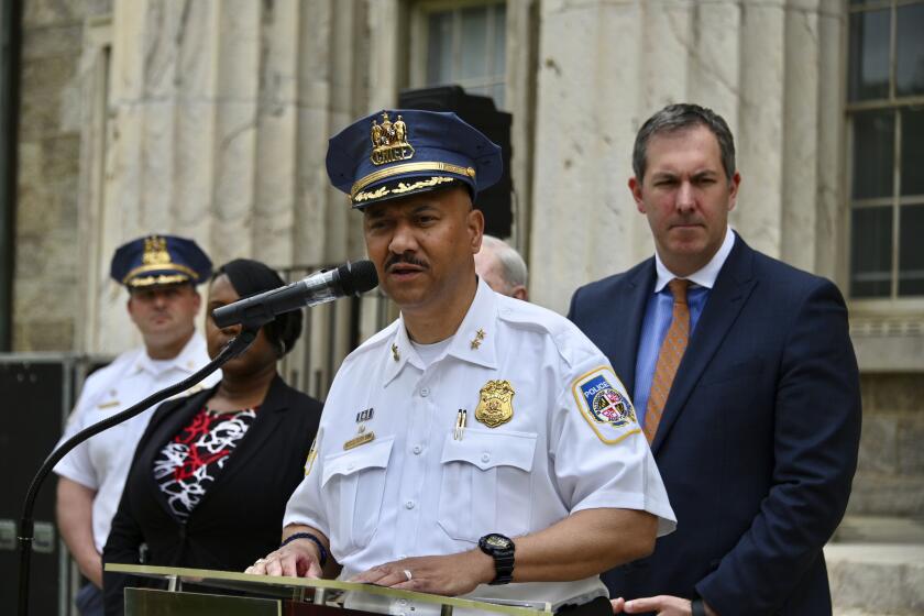FILE - Baltimore County Police Chief Robert McCullough and other local officials speak at a news conference in Towson, Md., April 25, 2024. The most recent criminal case to involve artificial intelligence has emerged from a high school in Baltimore County, Maryland. That's where police say a principal was framed by a fake recording of his voice. (Kim Hairston/The Baltimore Sun via AP, file)