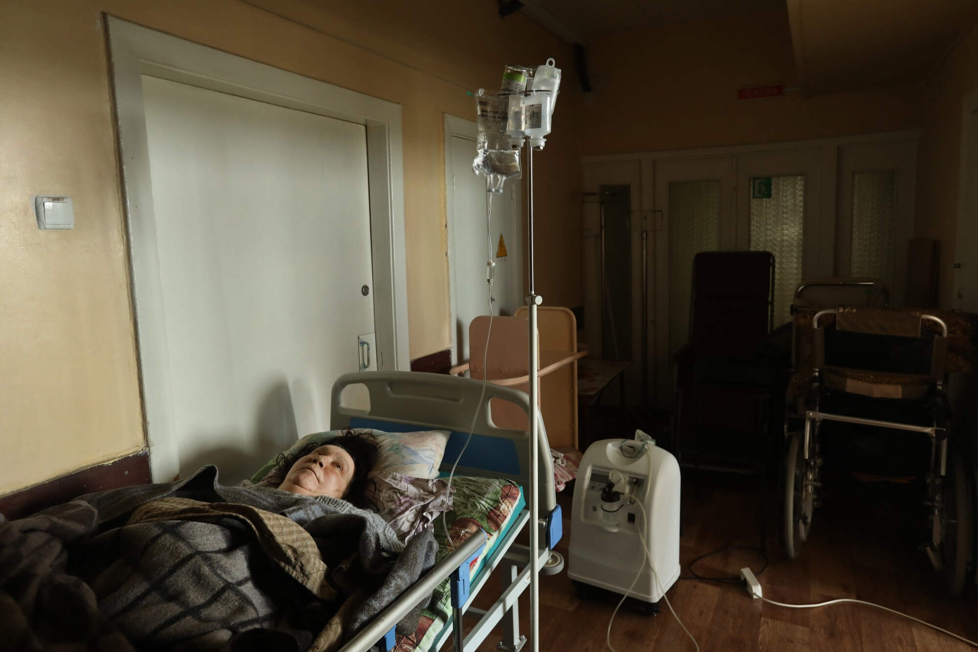 A woman in shock rests at a hospital in Severodonetsk.
