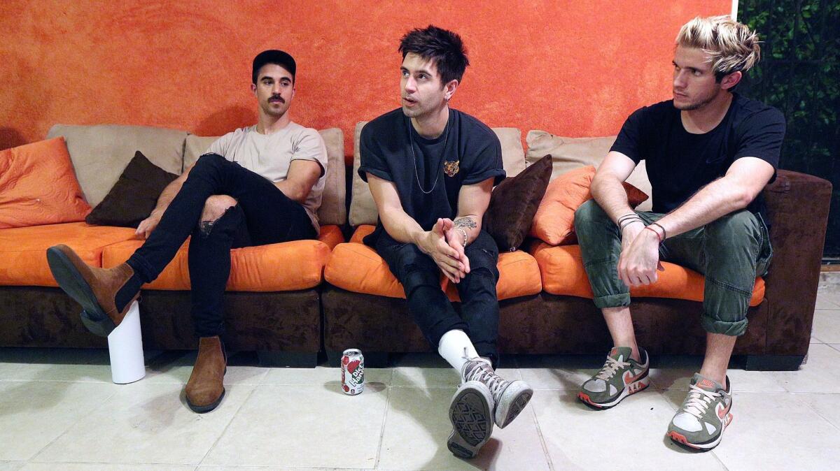 Lead singer Keith Longo talks about the band, with drummer Jordan Nuanez on the left and guitarist Chris Santillo on the right in their Eagle Rock studio.