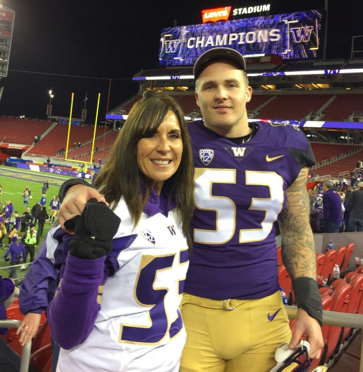 Maureen Cardosa with her son, Jake Wambaugh, a graduate and former football player at the University of Washington